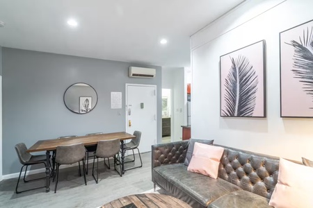 Your stylish open-concept space features comfortable seating and a dining area perfect for relaxing or sharing meals with friends.