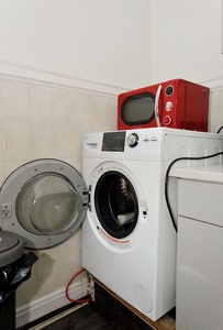 Your dedicated laundry space makes extended stays effortless, with modern appliances and even a microwave for quick meal prep convenience.