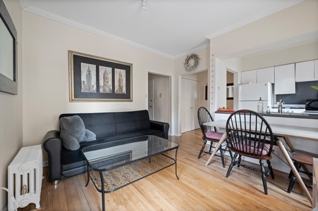 Step into your bright, open living space where modern comfort meets classic charm—perfect for relaxing after exploring the city.