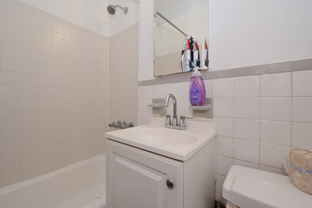 Your private bathroom features a clean shower, vanity with mirror, and all essentials for a refreshing start to your day.