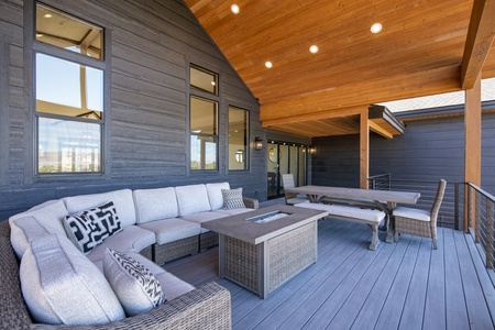 Mtn Shadow Lodge South-Deck area with patio furniture and fire table. (Main Floor East)