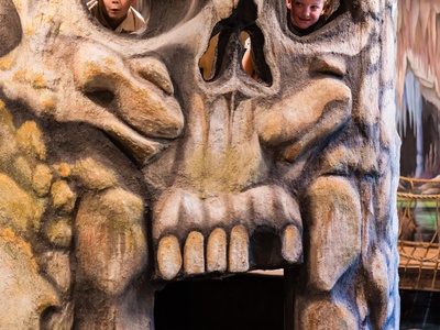 Playful entrance welcomes your family with whimsical carved face—kids can peek through for fun photos and giggles upon arrival.