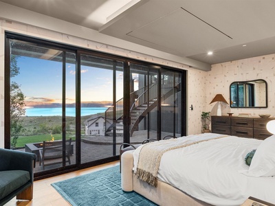 Wake up to stunning lake and mountain vistas framed by floor-to-ceiling windows. Your private balcony awaits just steps from your plush bed, perfect for morning coffee or sunset moments.