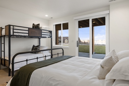 Black Timber Lodge-Bedroom with Private entrance to hot tub and patio.