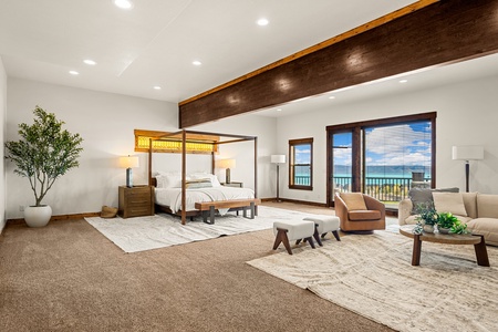 Wake up to the sound of waves in your spacious suite, where a stunning canopy bed and ocean views through the terrace doors invite you to unwind in style.