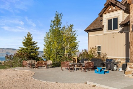 Averon Lodge - Bear Lake Luxury Rentals. Spacious patio with comfortable seating and grill overlooking stunning lake and mountain views - perfect for your morning coffee or evening gatherings.