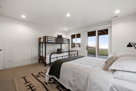 Black Timber Lodge-Bedroom with private entrance to hot tub and patio.