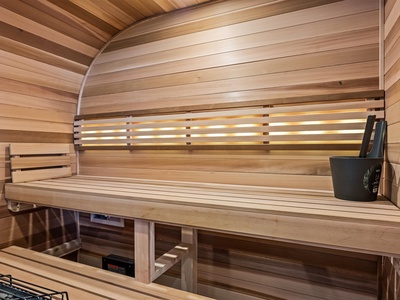 Step into your private sauna, where warm wood surrounds you and soft light invites deep relaxation. Unwind on smooth benches and let your cares melt away.