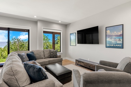 100 Acre Lodge-Family room seating area with TV (Main Floor East Center)