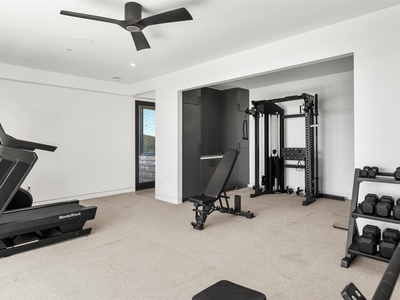 Stay on track with your fitness goals in your private, fully equipped gym with professional-grade equipment, free weights, and a serene workout space just for you.