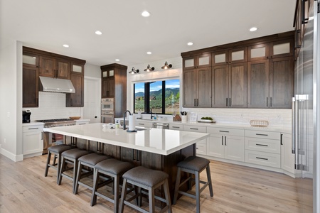 100 Acre Lodge-Kitchen Area with bar and seating for 9 (Main Floor West Center)