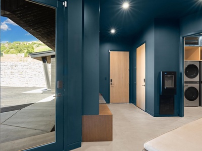 Step into your modern laundry space with sleek design, convenient appliances, and easy outdoor access—making chores effortless during your stay.