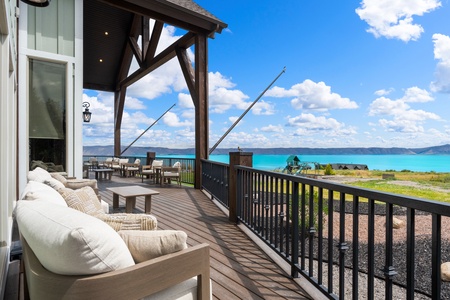 Sink into plush seating on your private covered deck and gaze out at stunning turquoise waters stretching to the horizon—pure relaxation with breathtaking lake views.