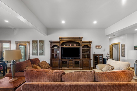 Averon Lodge - Bear Lake Luxury Rentals. Sink into plush seating while your favorite shows come alive on the grand entertainment center in this inviting living space.