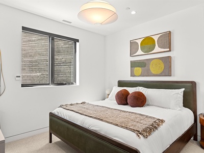 Sink into crisp linens and modern comfort in your private bedroom, designed with clean lines, warm textures, and natural light to help you unwind completely.