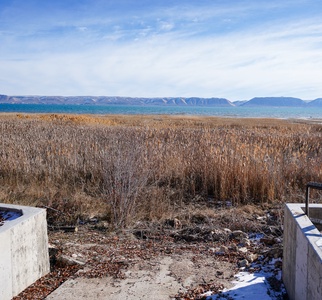 Stunning lakefront location with majestic mountain vistas and pristine natural surroundings in the peaceful winter landscape.