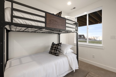 Black Timber Lodge-Bedroom with private entrance to hot tub and patio.