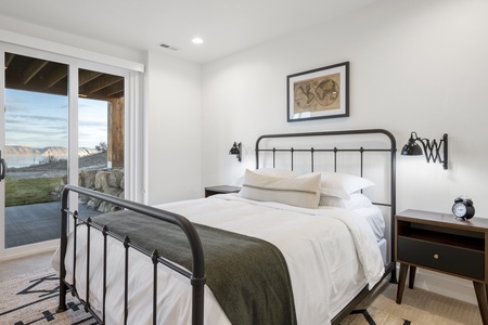 Black Timber Lodge-Bedroom with private entrance to hot tub and patio.