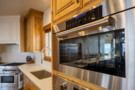 Your fully equipped kitchen features premium stainless steel appliances, including a built-in oven and microwave, making it easy to prepare everything from quick snacks to home-cooked meals during your stay.