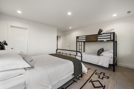 Black Timber Lodge-Bedroom with private entrance to hot tub and patio.