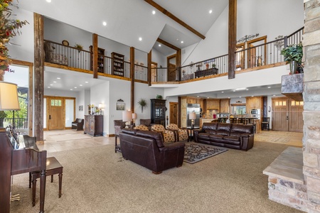 Averon Lodge - Bear Lake Luxury Rentals. Your spacious great room welcomes you with soaring ceilings, rich leather seating, and warm wood accents creating the perfect gathering space.