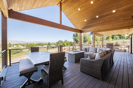 Mtn Shadow Lodge South-Deck area with patio furniture and fire table. (Main Floor East)