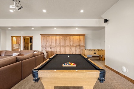 Challenge your friends to a game of pool or foosball in this inviting game room. With cozy seating and plenty of space to play, you'll find endless hours of entertainment right at your fingertips.