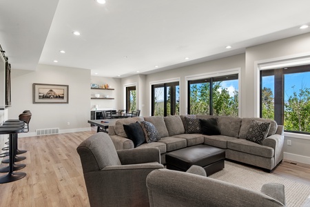 100 Acre Lodge-Family room seating area with TV (Main Floor East Center)