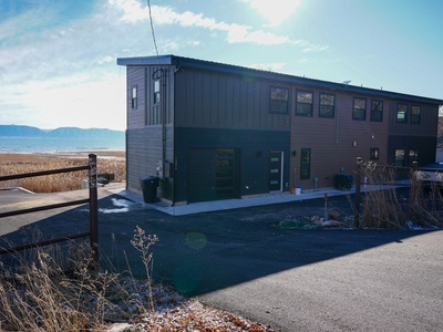 Waterfront retreat with stunning sea views and mountain backdrop, perfectly positioned for your coastal getaway.