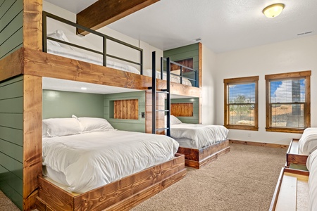 Climb into your cozy bunk and drift off surrounded by warm wood tones and peaceful green accents—perfect for families or groups traveling together.