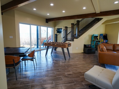 Challenge friends to foosball while arcade games await your turn in this spacious entertainment haven with leather seating.