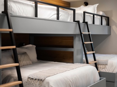 Comfy custom bunks with crisp linens and modern design—your crew will love climbing into these cozy sleep spaces at night.