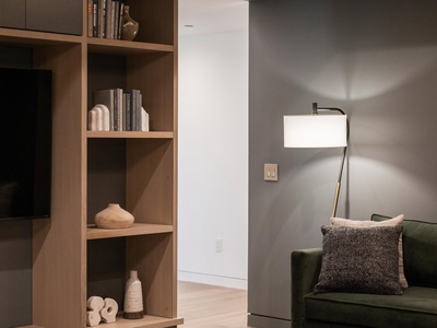 Sink into the plush reading nook, where warm lighting and thoughtful design invite you to unwind with your favorite book after a day of exploring.