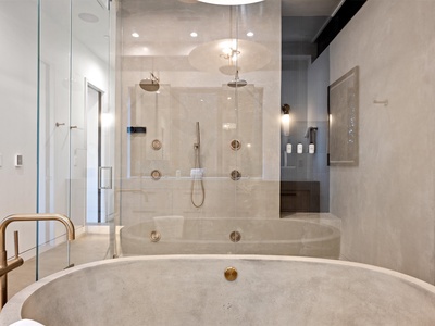 Unwind in your spa-like retreat with a luxurious soaking tub, dual rainfall shower, and elegant finishes that turn every moment into pure relaxation.