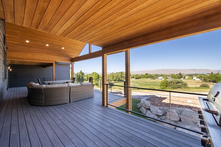 Mtn Shadow Lodge South-Deck area with patio furniture and fire table. (Main Floor East)