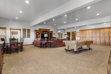Averon Lodge - Bear Lake Luxury Rentals. Unwind in your spacious game room with pool table, cozy seating, and entertainment center - perfect for family fun and relaxation.