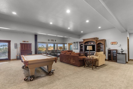 Averon Lodge - Bear Lake Luxury Rentals. Unwind in your spacious game room with pool table, cozy seating, and entertainment center—perfect for evening relaxation after exploring.