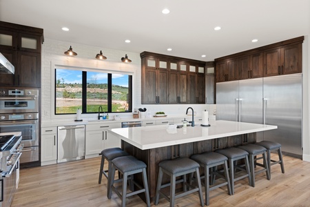 100 Acre Lodge-Kitchen Area with bar and seating for 9 (Main Floor West Center)