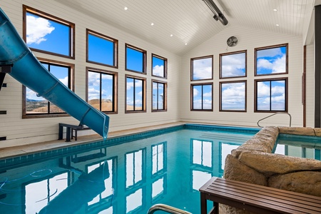 Splash into your own private indoor pool, complete with a thrilling waterslide and stunning mountain vistas through floor-to-ceiling windows.