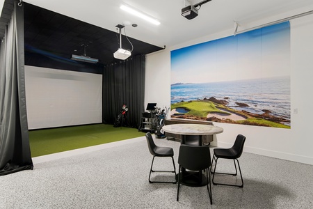 100 Acre Lodge-Golf Simulator with optional golf club rental upgrades available. (Main Floor South-Garage)