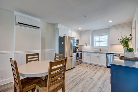 Cook and dine in comfort with your fully equipped kitchen featuring stainless steel appliances and air conditioning.