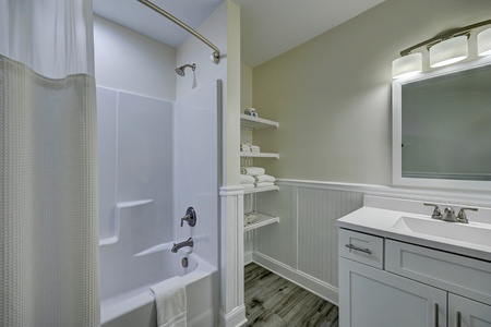 Step into your clean, modern bathroom with refreshing shower-tub combo and plenty of storage for your essentials.