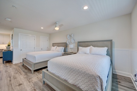 Relax in your spacious room with two plush beds, perfect for sharing with family or friends while enjoying modern comfort.