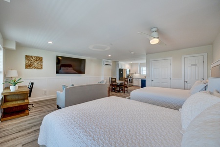 Your spacious suite offers comfort and convenience with two queen beds, full kitchen, and open floor plan perfect for families.