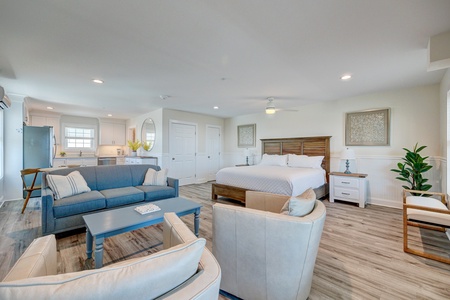 Relax in your spacious suite where coastal-inspired blues meet warm wood tones, creating the perfect blend of comfort and style.