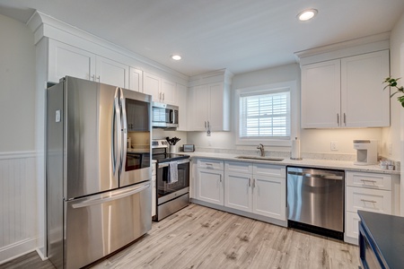 Cook comfortably in your fully equipped kitchen featuring stainless steel appliances, granite counters, and plenty of cabinet space for all your needs.