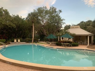 The community pool is behind the house