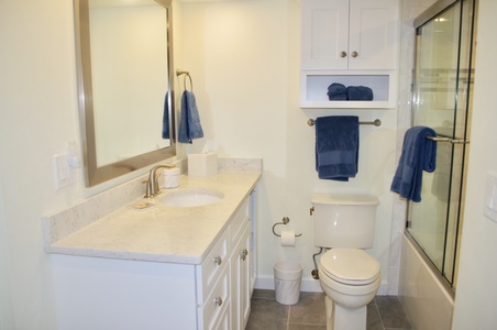 The main bathroom has an oversized vanity and extra deep soaking tub.