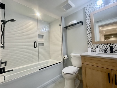 The guest bath features a tub/shower combination.