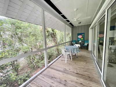 The screened porch is spacious and airy.